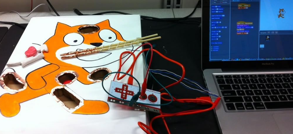 Scratch cat cutout with conductive touch points connected to a Makey Makey
