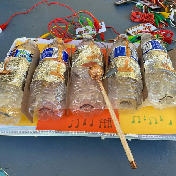 Water-bottle percussion instrument wired to a Makey Makey