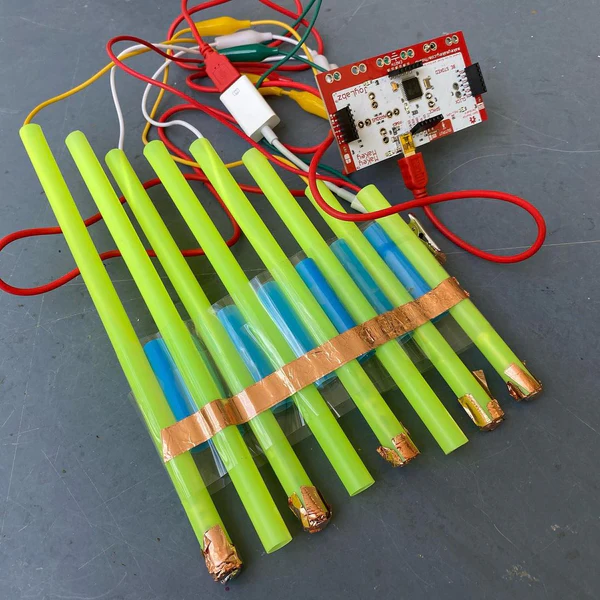 Pan flute instrument made from straws and copper tape connected to a Makey Makey